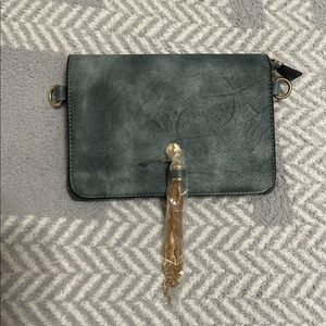 Small crossbody bag with gold tassel NWOT